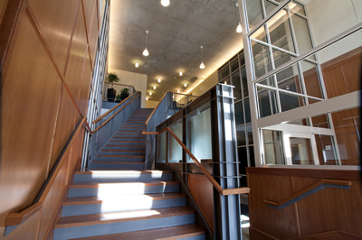 open office stairway leading up to reception area